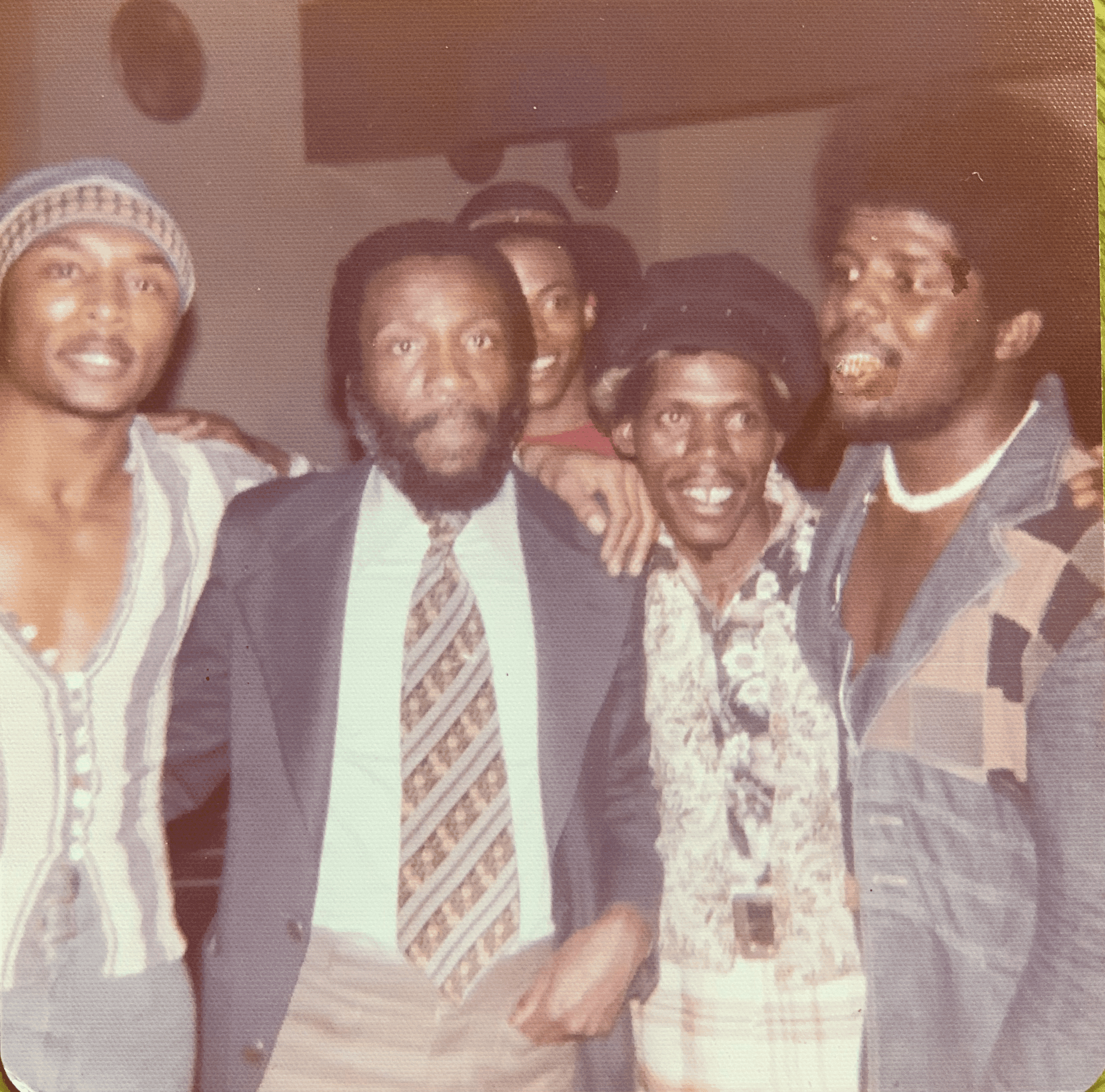 Robert D. Palmer with Dick Gregory and members of Booty People. Photograph from the Palmer family archive.